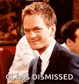 a man in a suit and tie is sitting at a table in a restaurant .