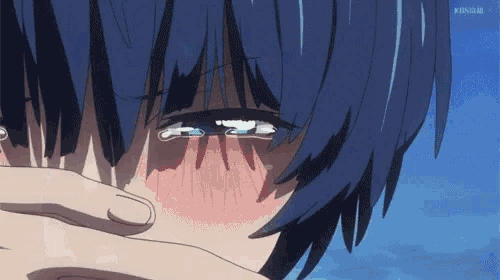 a close up of a person covering their face with their hands