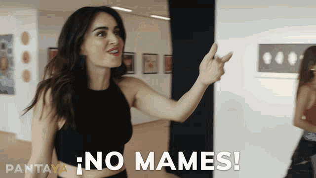 a woman in a black top says " no mames " in spanish