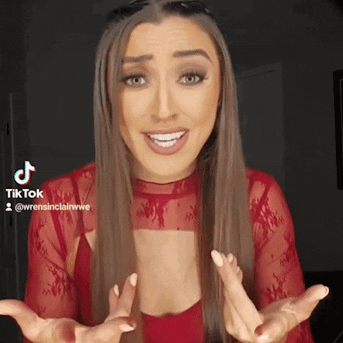 a woman in a red lace top is making a funny face and has a tiktok account