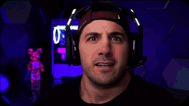 a man wearing headphones with the words at 11 written on the bottom