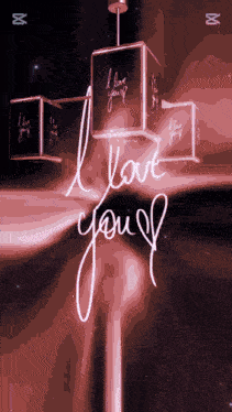 a neon sign that says " i love you " on it