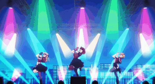 three girls are dancing on a stage with lots of lights