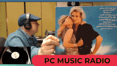 a man wearing headphones holds a picture of a man and woman in front of a pc music radio sign