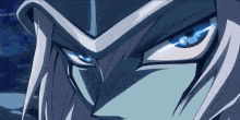 a close up of a cartoon character 's face with blue eyes .