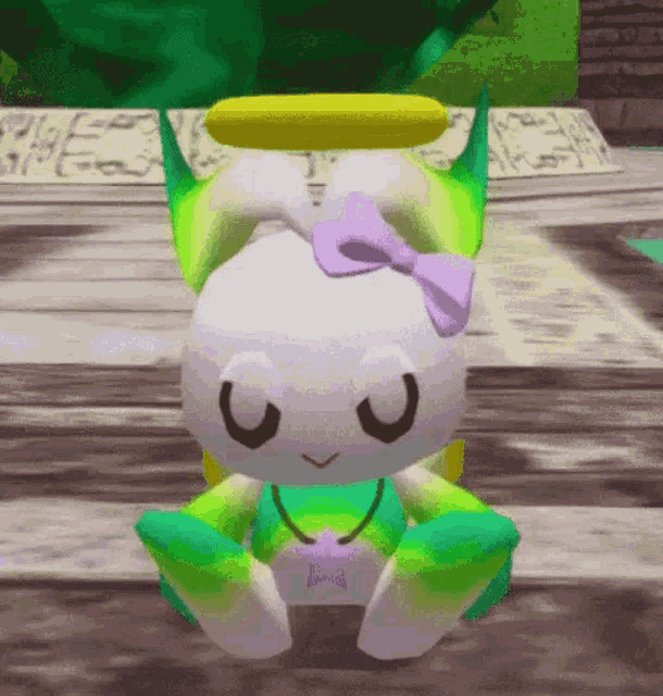 a stuffed animal with a purple bow on its head and a yellow halo