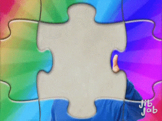 a jigsaw puzzle with a rainbow background and the word jab on the bottom left