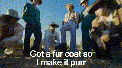 a group of people are standing in a field with the words got a fur coat so i make it purr on the bottom