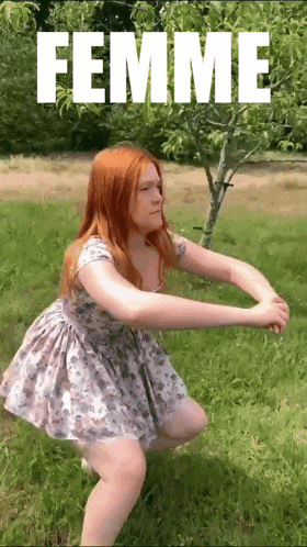 a woman in a dress squatting in the grass with the word femme behind her