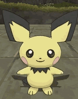 a yellow pokemon with black ears is standing on a sidewalk