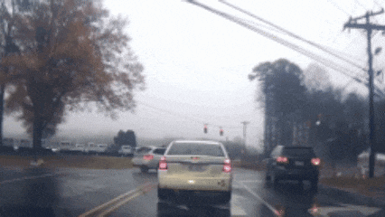 a white car with a license plate that says ' jc ' on it
