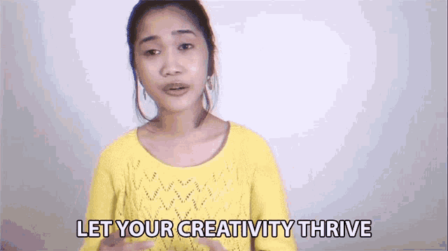 a woman in a yellow sweater is saying let your creativity thrive .