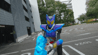 a purple and blue robot is fighting another robot in a parking lot with the number 2024 written on the ground