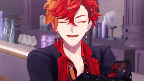 a man with red hair is smiling while holding a phone