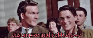 jasonayze and robbielowe are standing next to each other in front of a crowd of people