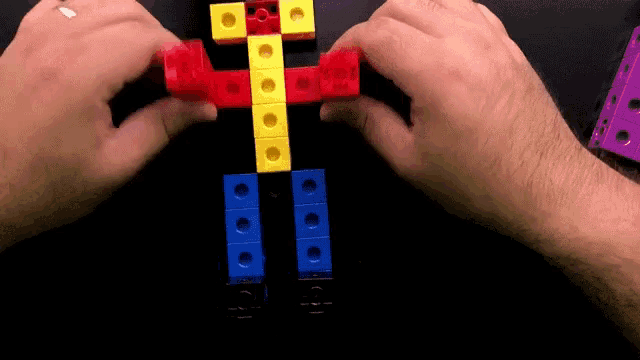 a person is playing with a colorful toy that looks like a robot