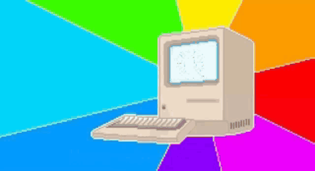 a computer is sitting in front of a rainbow colored background .