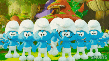 a group of smurfs standing next to each other with the word smurfs above them