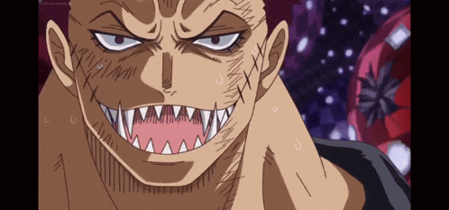 a close up of a man 's face with sharp teeth and stitches on his face
