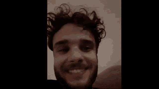 a blurry picture of a man 's face in a dark room