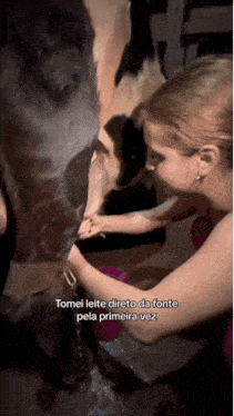 a woman milking a cow with the caption tomei leite directo da fonte pela primeira vez