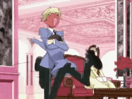a man is sitting on another man 's lap in a room