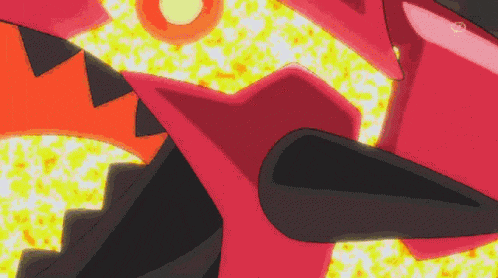 a close up of a red and yellow object with a yellow background