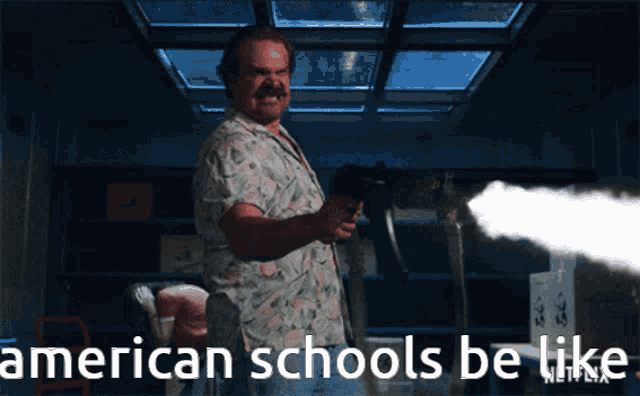 a man holding a gun with the words american schools be like on the bottom