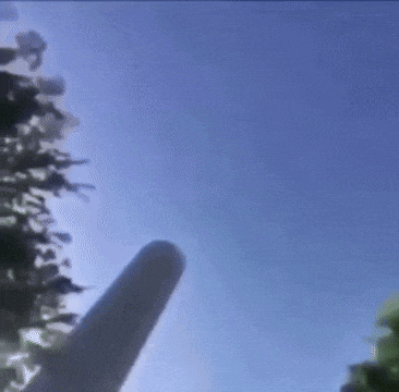 a person is flying through a blue sky