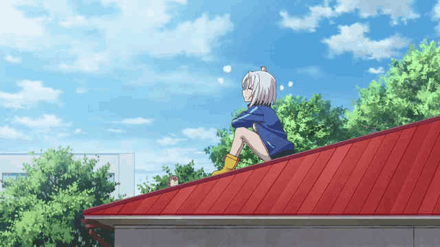 a girl sits on the roof of a building looking at the sky