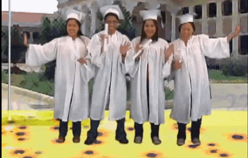a group of female graduates are posing for a picture together