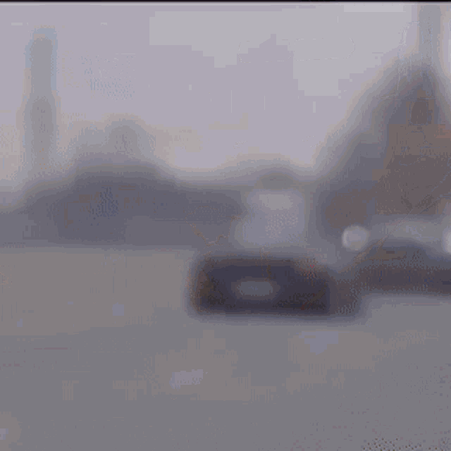 a black car is parked on the side of the road with the time of 63 minutes