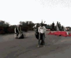 a blurry picture of a group of people standing on a street
