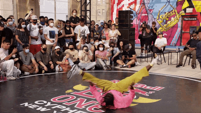 a group of people are gathered around a dance floor that says " one " on it