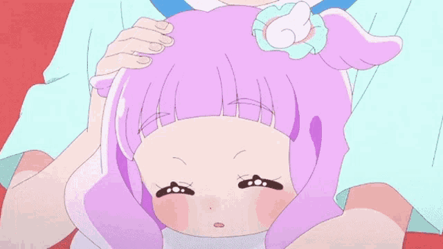 a close up of a cartoon girl with purple hair and a bow in her hair .