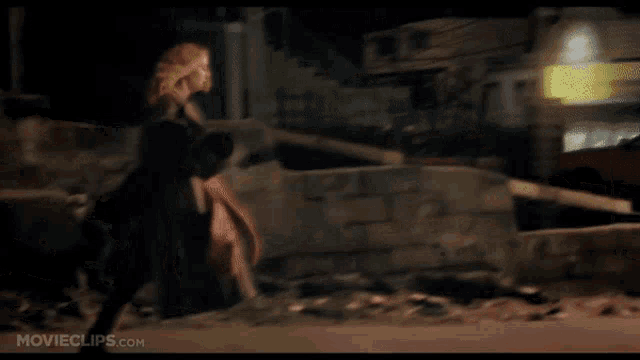 a movie clip from movieclips.com shows a woman walking in front of a car
