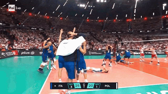 a volleyball game between italy and poland is being played