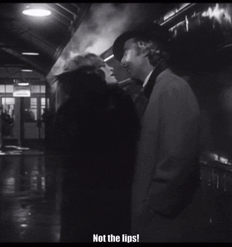 a black and white photo of a man and woman with the caption " not the lips "