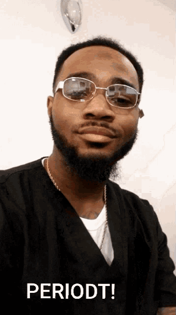 a man wearing glasses and a black shirt has the word periodt written below him