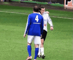 a man in a blue jersey with the number 4 on it