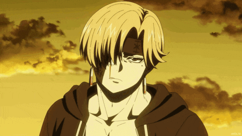 a man with a bandage on his forehead looks at the camera with a sunset in the background