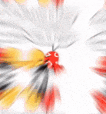 a blurry picture of a red and yellow object with a speech bubble .