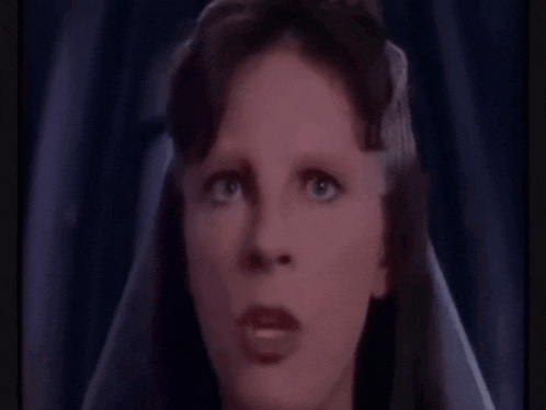 a woman with a veil on her head says " if you value your lives be somewhere else "