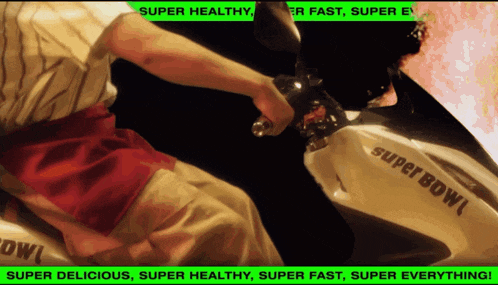 a person is riding a super bowl scooter
