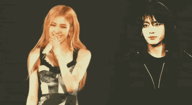 a man and a woman are standing next to each other and the man is wearing a black shirt
