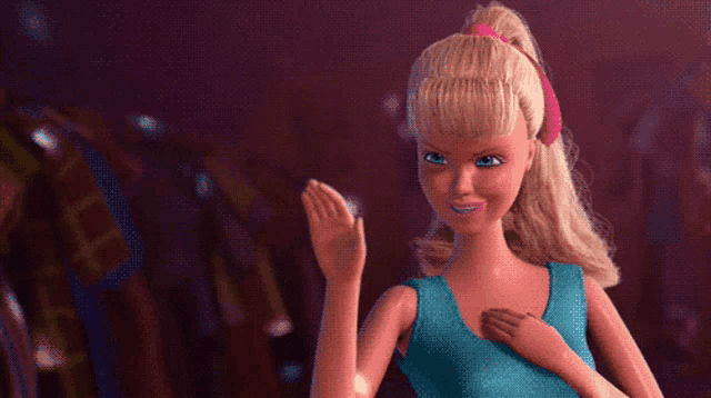 a barbie doll wearing a blue tank top is waving