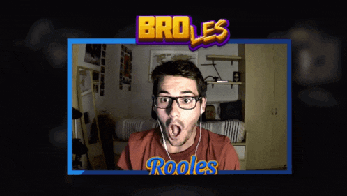 a man wearing glasses and a red shirt with the name rooles on the front