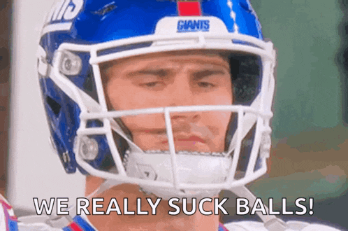 a football player wearing a helmet says we really suck balls