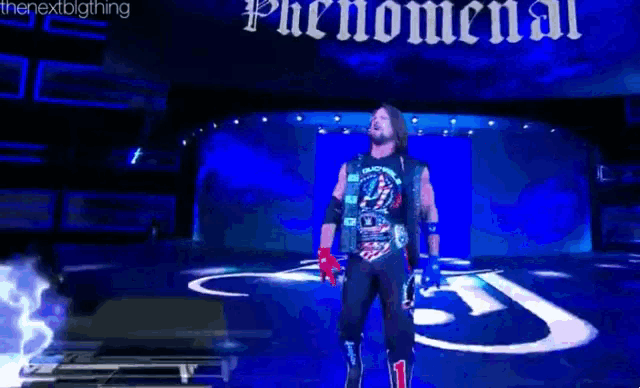 a wrestler is walking on a stage with the word phenomenal on the bottom