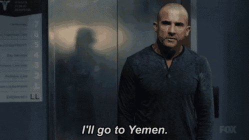 a man standing in front of an elevator with the words i 'll go to yemen